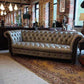 Grey Leather Chesterfield-Style Sofa — photograph 1