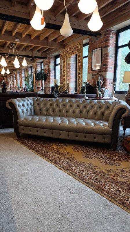 Grey Leather Chesterfield-Style Sofa — photograph 1